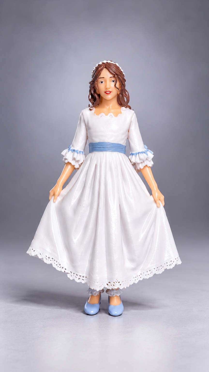 Figura de comunión con vestido blanco y lazo azul